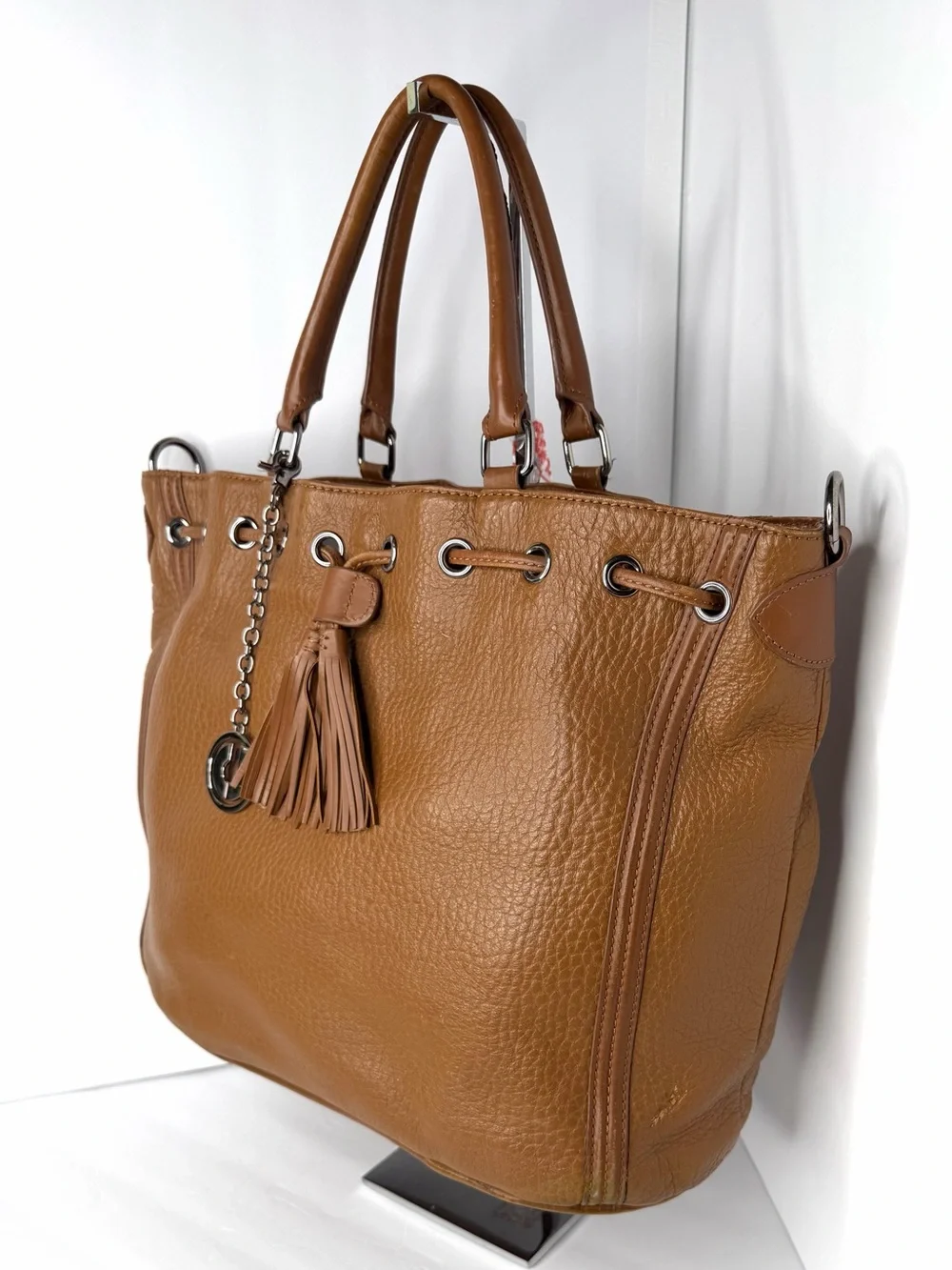 Stylish Tan Leather Satchel with Tassel Charm